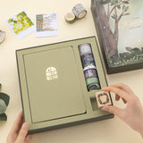 Hand taking out wreath border rubber stamp from Komorebi box set
