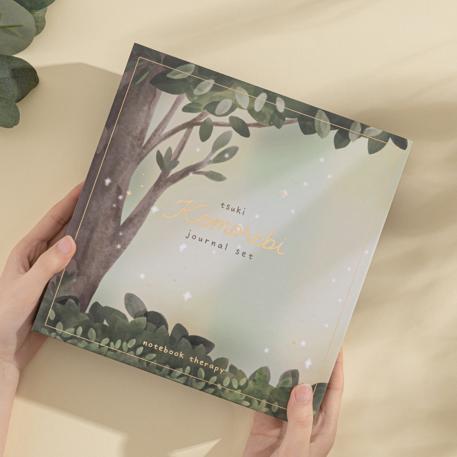Gold gilded page edges on green Komorebi bullet journal