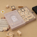 Tsuki Light Academia bullet journal stamp set with opened drawer style box reveaing 16x Light Academia themed stamps