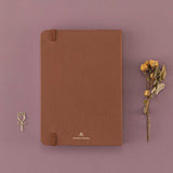 Back cover of Tsuki ‘Vintage Rose’ Limited Edition Bullet Journal with dried roses and free rose paperclip gift on mauve background