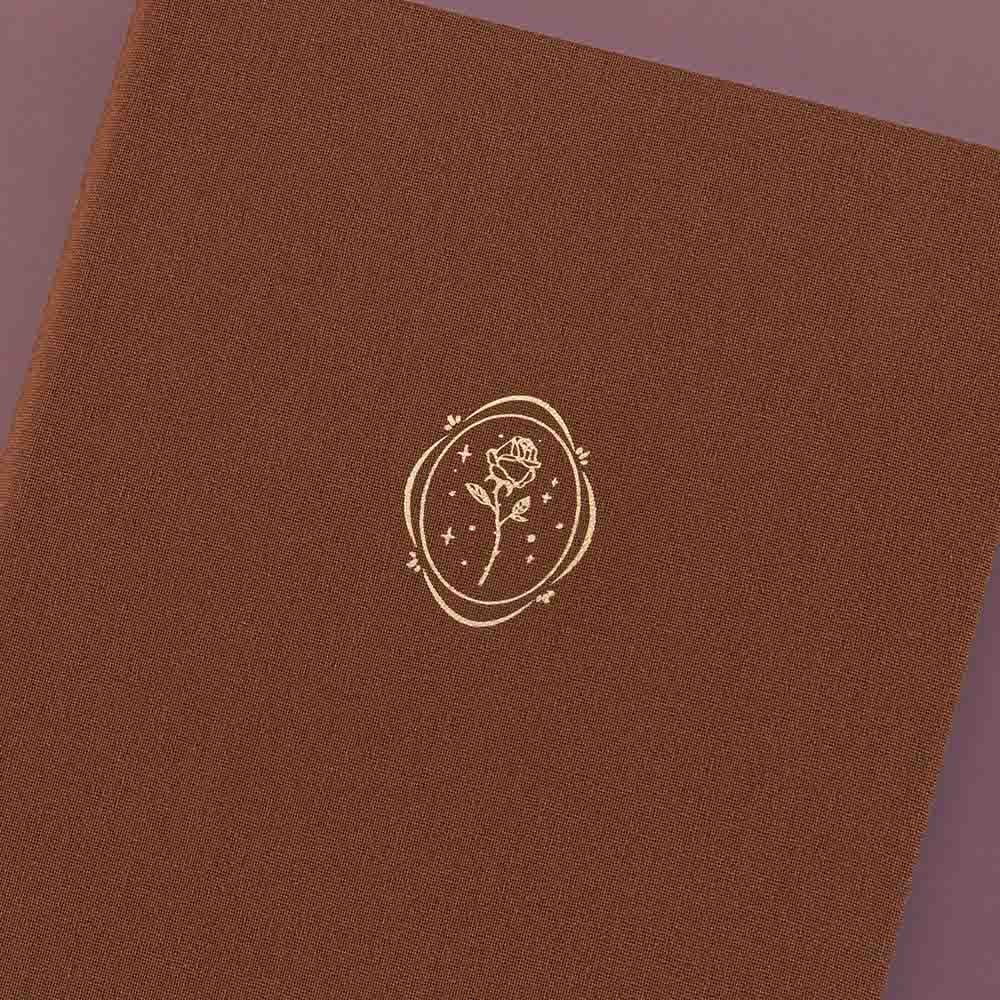 Close up of the front cover of Tsuki ‘Vintage Rose’ Limited Edition Bullet Journal on mauve background