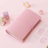 Tsuki ‘Sakura Journey’ Limited Edition Travel Notebook with Tsuki ‘Sakura Journey’ Vintage Journey Washi Tape Set with cherry blossoms on pink background