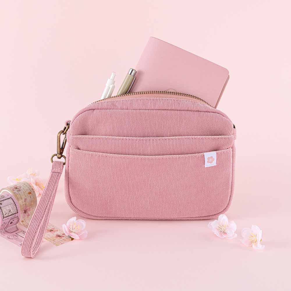 Tsuki ‘Sakura Journey’ Travel Pouch with Tsuki ‘Sakura Journey’ Limited Edition Travel Notebook and pens inside with Tsuki ‘Sakura Journey’ Vintage Journal Washi Tape Set with cherry blossoms in pink background