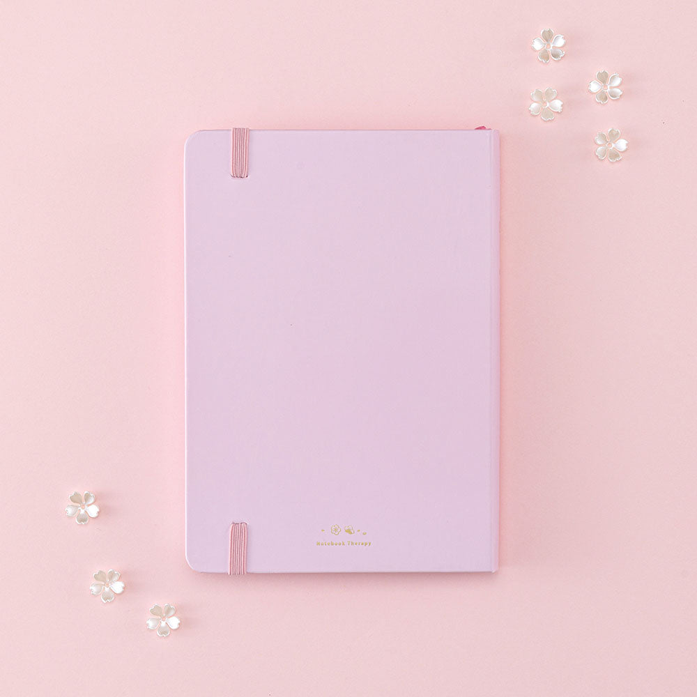 Back cover of Tsuki Four Seasons: Spring Collector’s Edition 2022 Bullet Journal with flowers on light pink background
