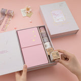 Hand taking out dice stamp from Sakura Beeze travel notebook gift set