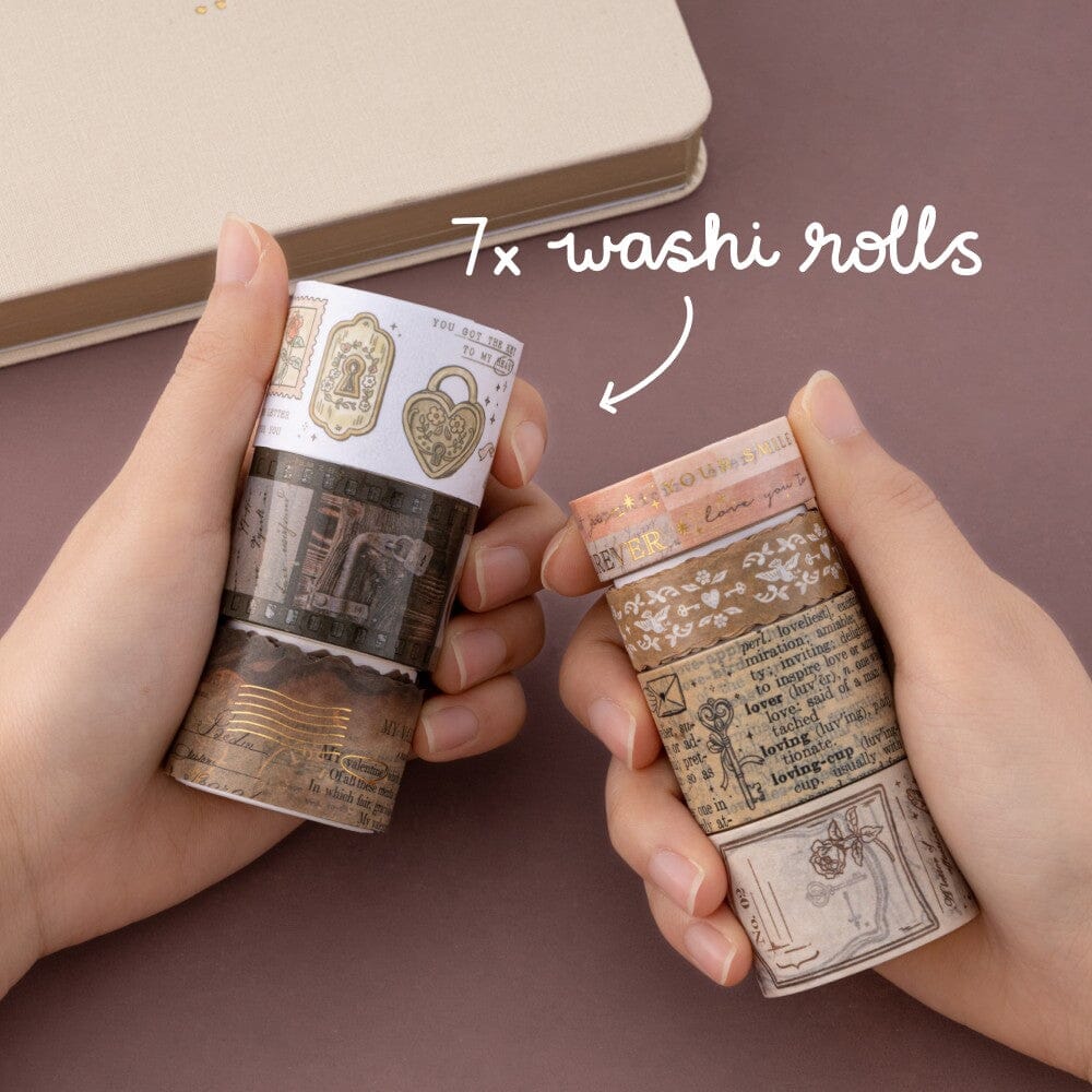 Hands holding 7x washi rolls