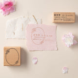 Sakura fubuki stamp with cherry blossom frame stamp on pink paper