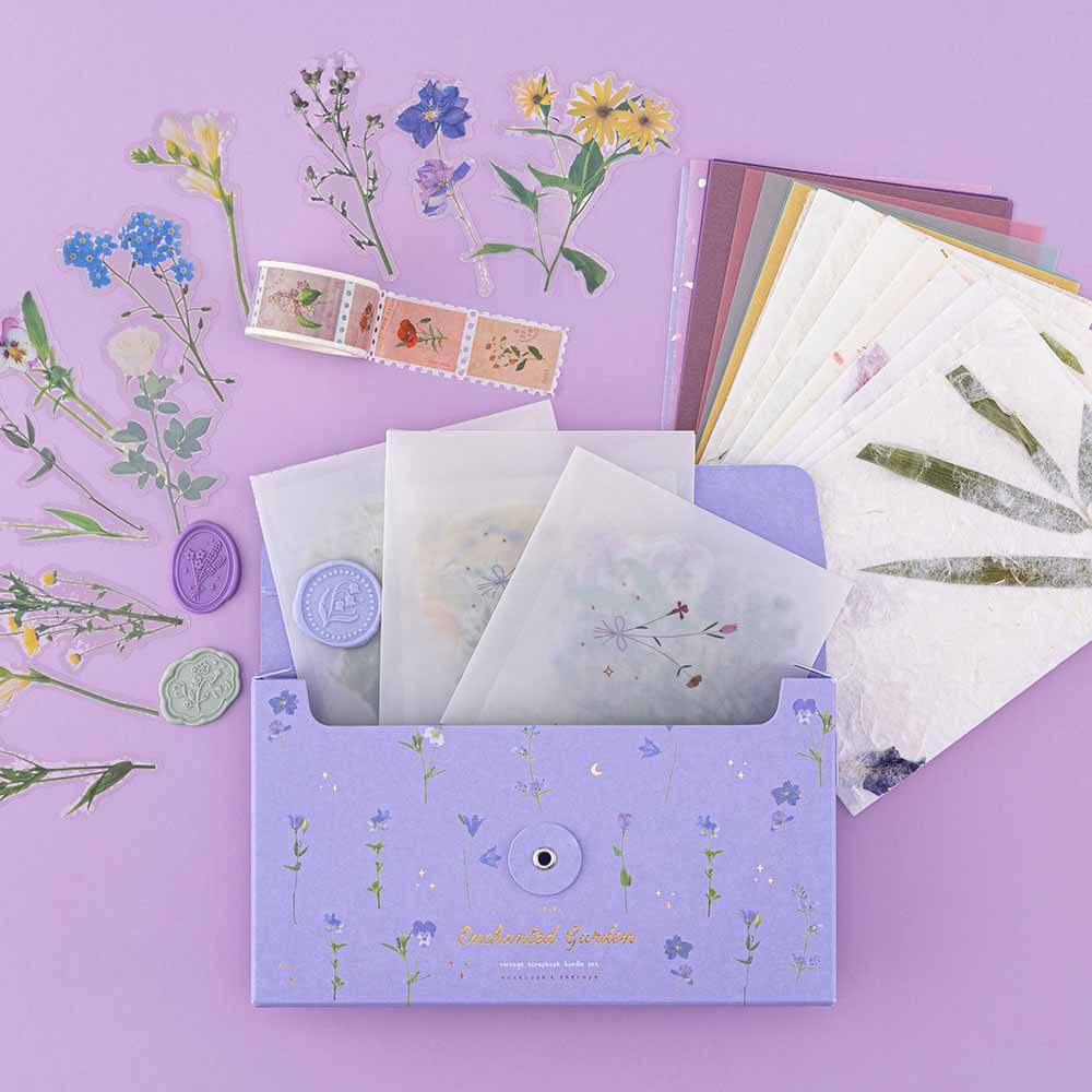 3x glassine bags with flower stickers in a purple box with flower decorations