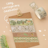 Tsuki Mori Washi Tape set on kraft card with gold clip and white writing that says “cotagecore aesthetic”
