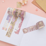Sakura Breeze washi tape rolls on white dotted paper
