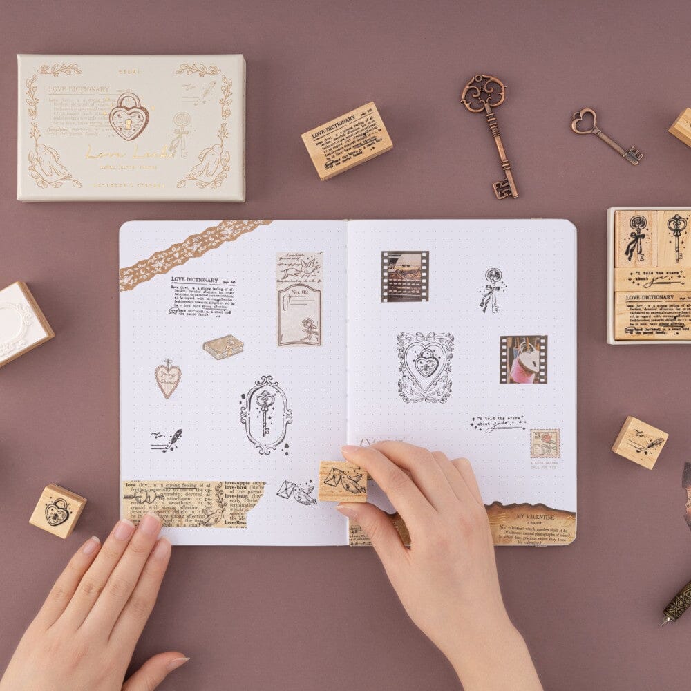 Hand stamping little dove with letter in mouth stamp on bullet journal spread