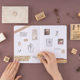 Hand stamping little dove with letter in mouth stamp on bullet journal spread