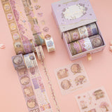 Sakura Breeze washi tape rolls on pink background