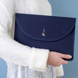 Model holding Cloud Dreamland notebook pouch