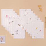 Tsuki Handmade Petal Paper Pack with polaroid picture and autumn leaves on beige background