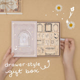 Drawer style gift box lettering in white and an arrow pointing at Light Academia stamp set box