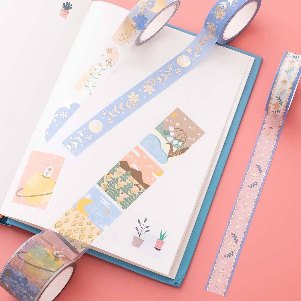 Tsuki ‘Moonflower’ Washi Tape Set on open bullet journal page on coral pink background