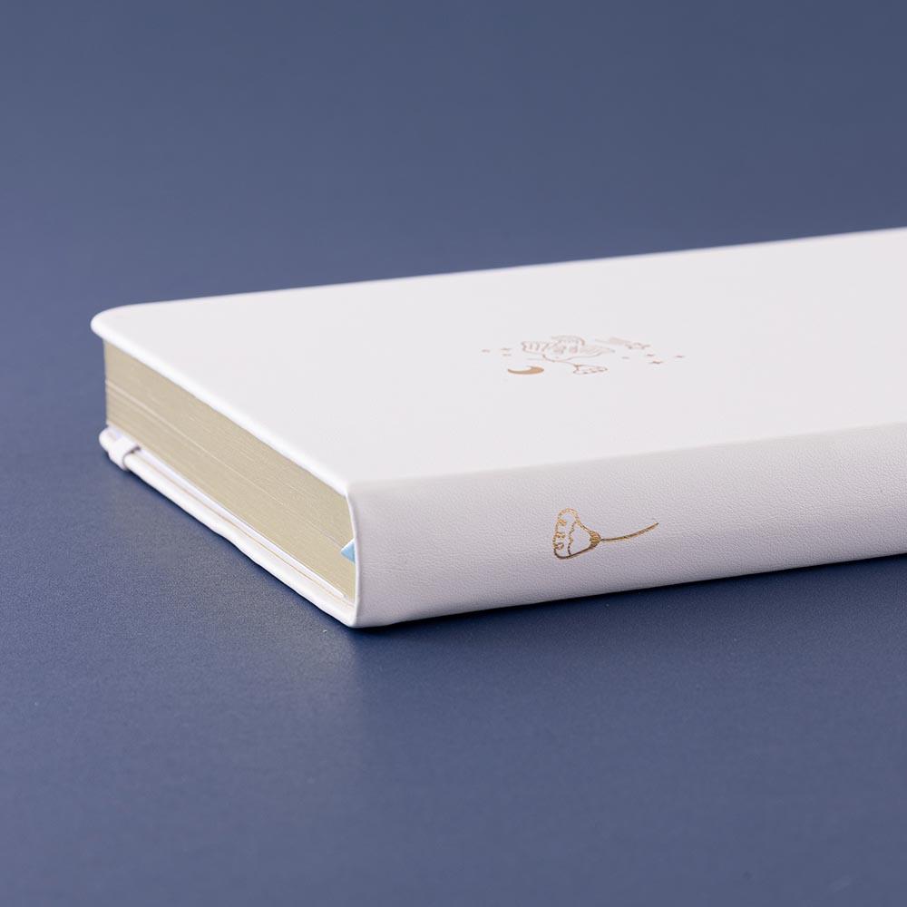 Close up of Tsuki ‘Suzume’ Winter Limited Edition Bullet Journal on navy background