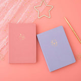 Tsuki ‘Full Bloom’ Limited Edition Bullet Journal with Tsuki ‘Suzume’ Limited Edition Notebook with free gifts and pen with netting on coral pink background
