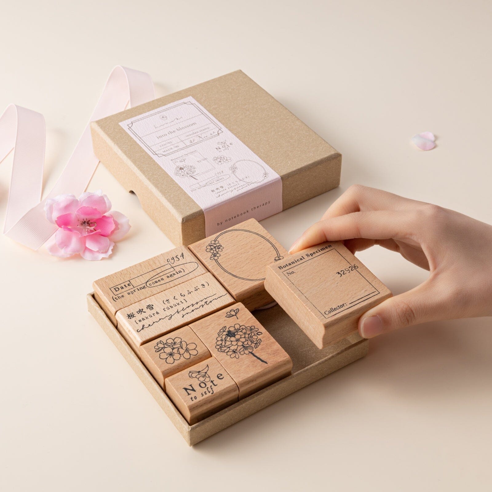 Hand taking out a stamp from Hinoki into the blossom stamp set