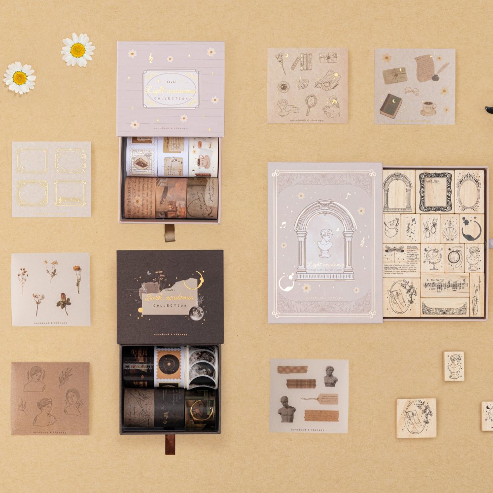Tsuki Academia collection flatlay including Dark Academia washi tape set, Light Academia bullet journal stamp set, Light Academia washi tape set