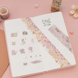 Cherry blossom themed washi tapes and stickers on bullet journal