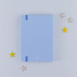Back cover of Tsuki Four Seasons Winter Collector’s Edition Bullet Journal with stars on light blue background
