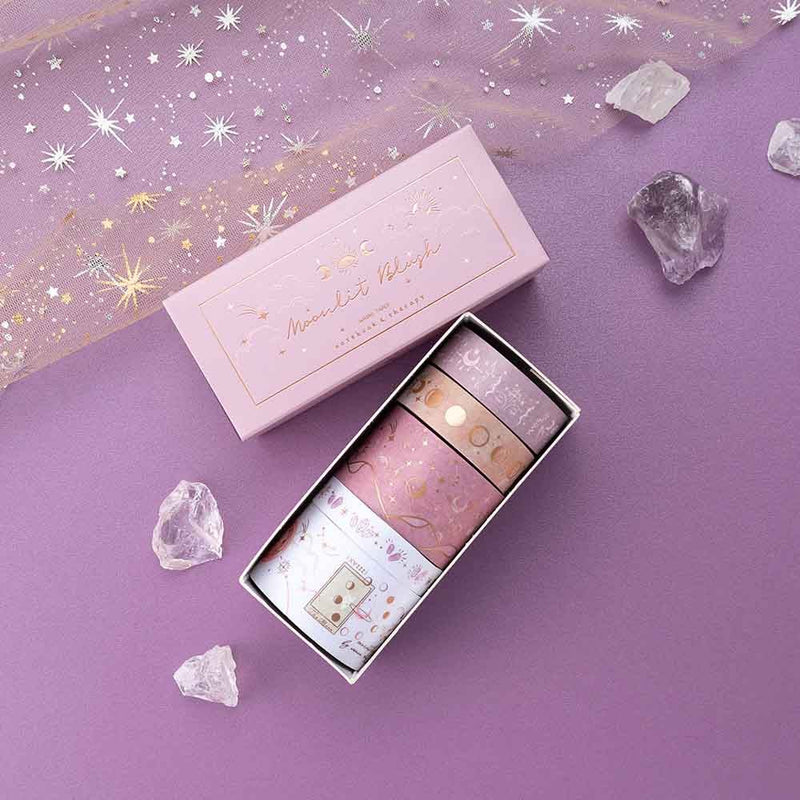 Close up of Tsuki ‘Moonlit Blush’ Washi Tape Set with amethyst stones and sparkly netting on purple background