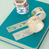 Close up of Tsuki ‘Flutter + Dream’ Washi Tape Set by Notebook Therapy x Pelinkan on Tsuki Teal Sky ‘Flutter + Dream’ Limited Edition Bullet Journal by Notebook Therapy x Pelinkan on mint background