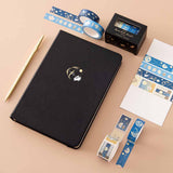 Tsuki ‘Moonlit Wish’ Limited Edition Bullet Journal with Tsuki ‘Moonlit Wish’ Washi Tapes Set with bright white card and gold pen on light brown background