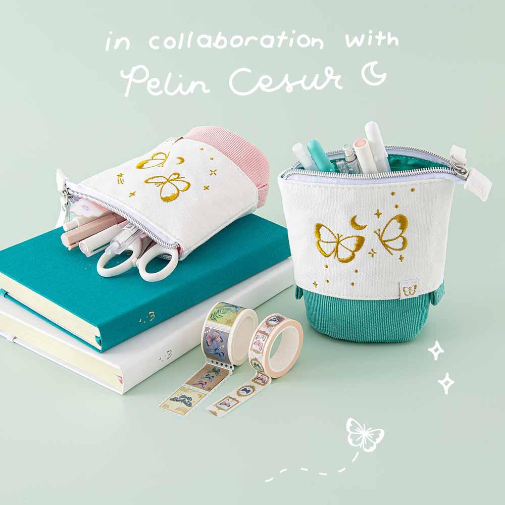 Tsuki ‘Flutter + Dream’ Pop-Up Pencil Cases by Notebook Therapy x Pelinkan in teal and pastel pink on Tsuki Cloud White Sky ‘Flutter + Dream’ Limited Edition Bullet Journal by Notebook Therapy x Pelinkan and Tsuki Teal Sky ‘Flutter + Dream’ Limited Edition Bullet Journal by Notebook Therapy x Pelinkan with Tsuki ‘Flutter + Dream’ Washi Tapes by Notebook Therapy x Pelinkan in mint background