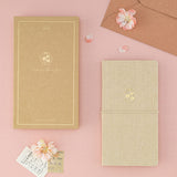 Flatlay of Tsuki ‘Sakura Breeze’ Kraft Paper Travel Notebook with box