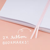 Close up of 2x ribbon bookmarks from Tsuki Sakura Breeze limited edition bullet journal by Notebook Therapy