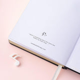 Close up of Tsuki Lunar Notes bullet journal last page image on pink background