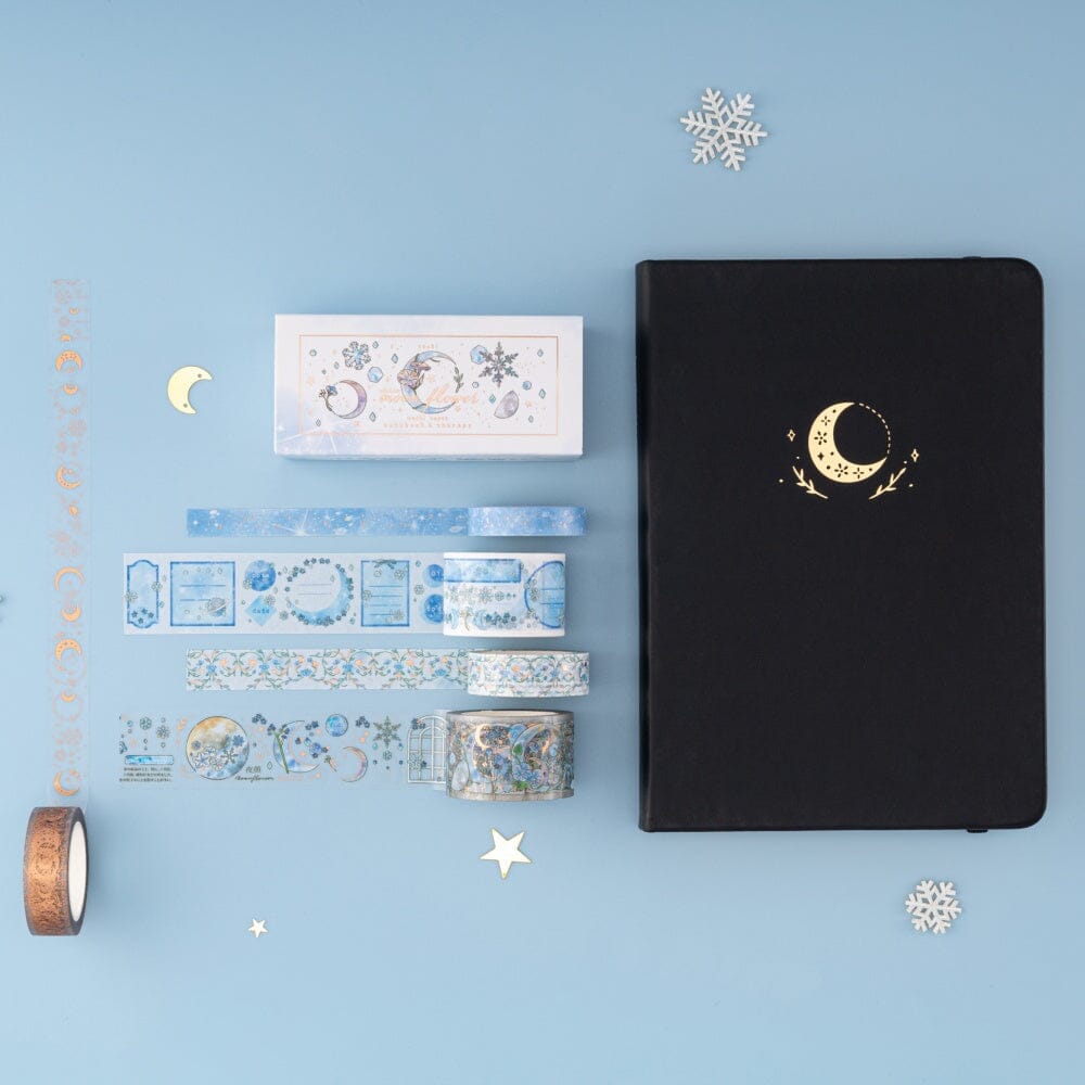 Flatlay of Winter Moonflower washi tape set with classic Tsuki Moonflower notebook in Black