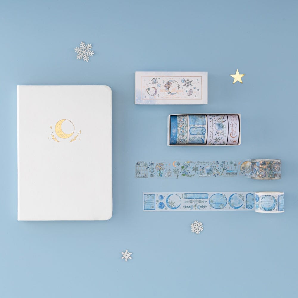 Flatlay of Winter Moonflower washi tape set with Tsuki Moonflower notebook in White