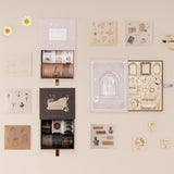 Tsuki Academia collection flatlay including Dark Academia washi tape set, Light Academia bullet journal stamp set, Light Academia washi tape set