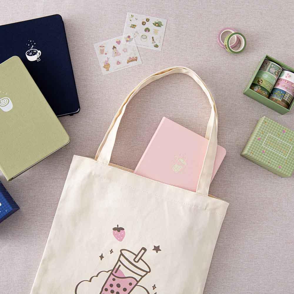 Tsuki ‘Matcha Ichigo’ Washi Tape Set and Tsuki ‘Ichigo’ Limited Edition Boba Bullet Journal and Tsuki ‘Ichigo’ Bobe Tote Bag on linen covered table