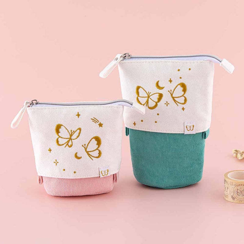 Tsuki ‘Flutter + Dream’ Pop-Up Pencil Cases by Notebook Therapy x Pelinkan in teal and pastel pink with Tsuki ‘Flutter + Dream’ Washi Tapes by Notebook Therapy x Pelinkan in pastel pink background