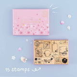 Tsuki ‘Sakura Journey’ Bullet Journal Stamp Set with fifteen stamps with cherry blossom petals on light blue background
