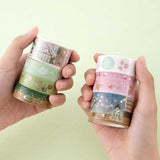 Tsuki ‘Matcha Ichigo’ Washi Tapes held in hands in matcha green background