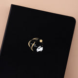 Tsuki ‘Moonlit Wish’ Limited Edition Bullet Journal on light brown background