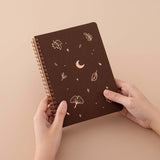 Tsuki ‘Maple Dreams’ Kraft Paper Ringbound Bullet Journal held in hands in beige background