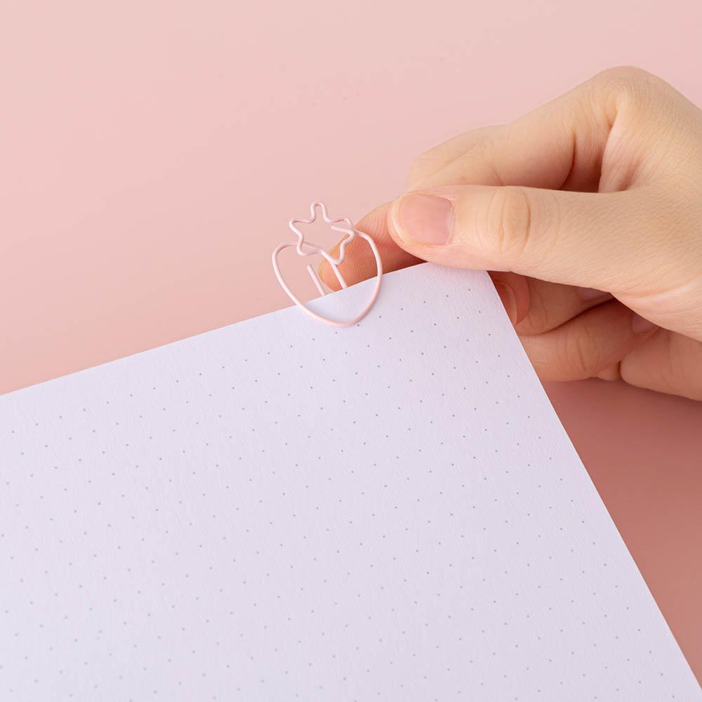 Close up of open page of Tsuki ‘Ichigo’ Limited Edition Boba Bullet Journal with free gift on light pink background