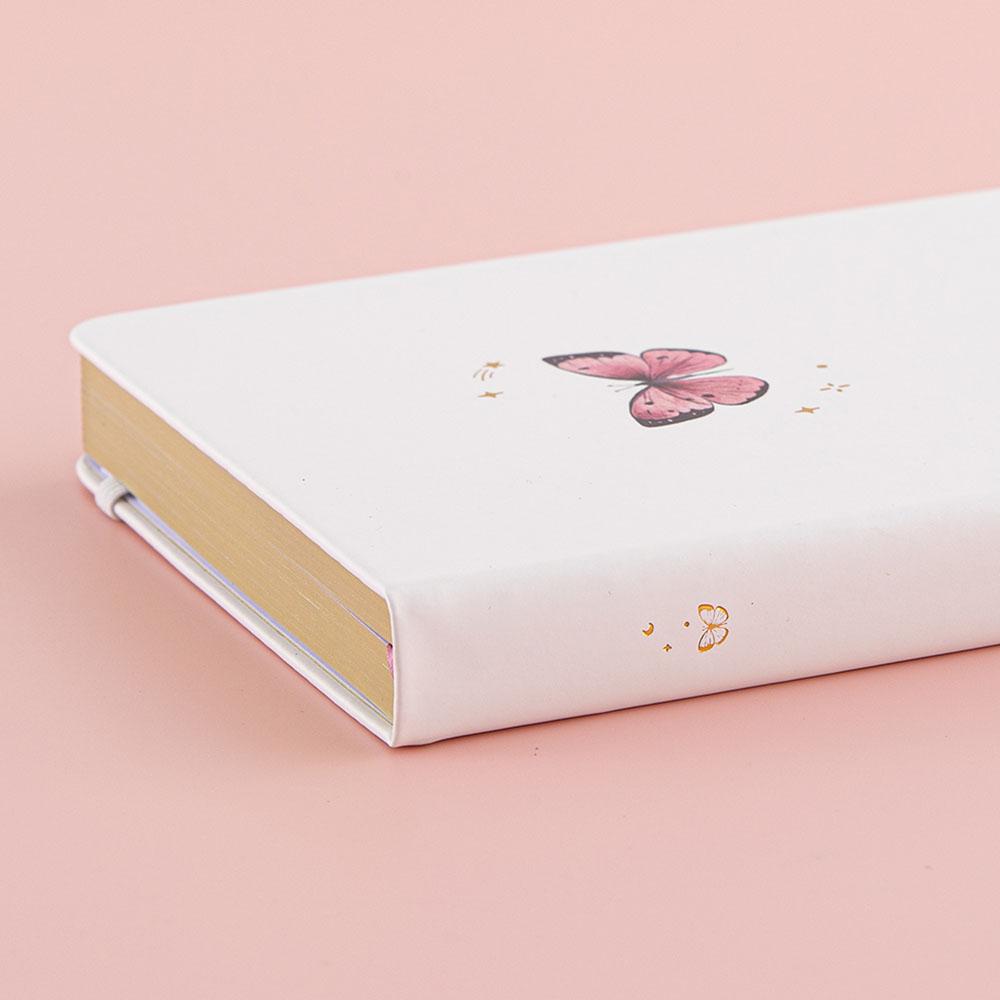Close up of Tsuki Cloud White ‘Flutter + Dream’ Limited Edition Bullet Journal by Notebook Therapy x Pelinkan on pastel pink background