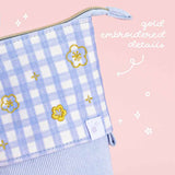 Close up of gold embroidered details of Tsuki ‘Sakura Journey’ Pop-Up Pencil Case on light pink background 