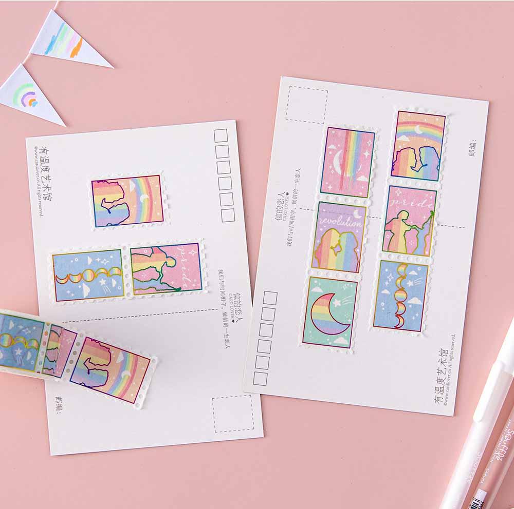 Tsuki Rainbow Pride Washi Tape on postcards with pens and bunting on light pink background