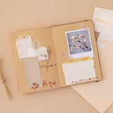 Tsuki Mixed Scrapbook Paper Pack on open Tsuki Kraft Paper Limited Edition Bullet Journal spread with polaroid picture and Tsuki ‘Maple Dreams’ Washi Tapes on beige background