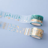 Close up of Tsuki ‘Moonflower’ Washi Stamp Tape Set on dusty blue background