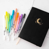 Gelly Roll Pens with Tsuki Black Paper Limited Edition Hardcover Bullet Journal in Moonflower on white background
